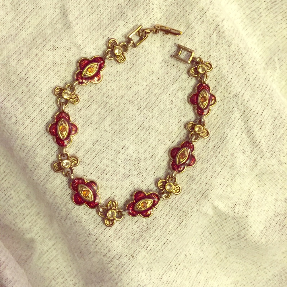 Gold, red, orange, and white flower bracelet.